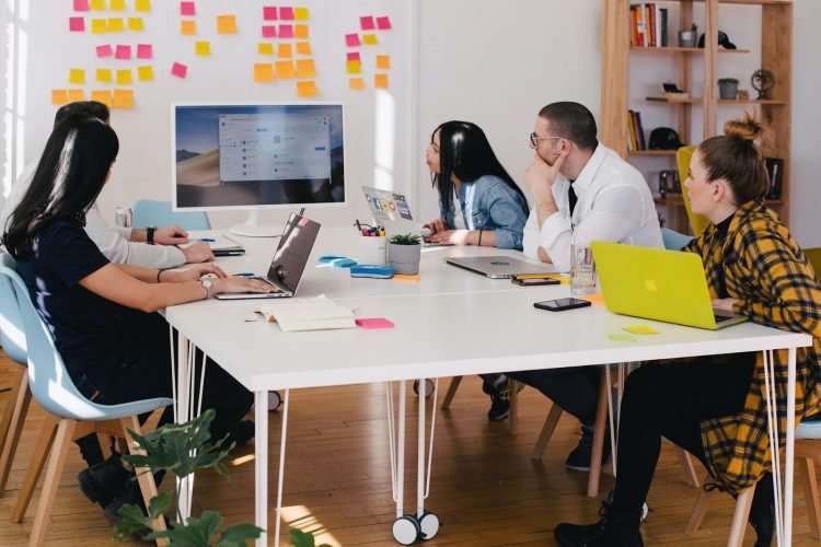 A picture of a newly started business having a team meeting.