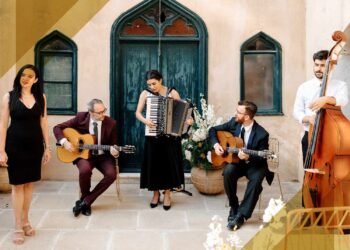 The Ultimate Guide to Deciding Between a Wedding Band and a DJ